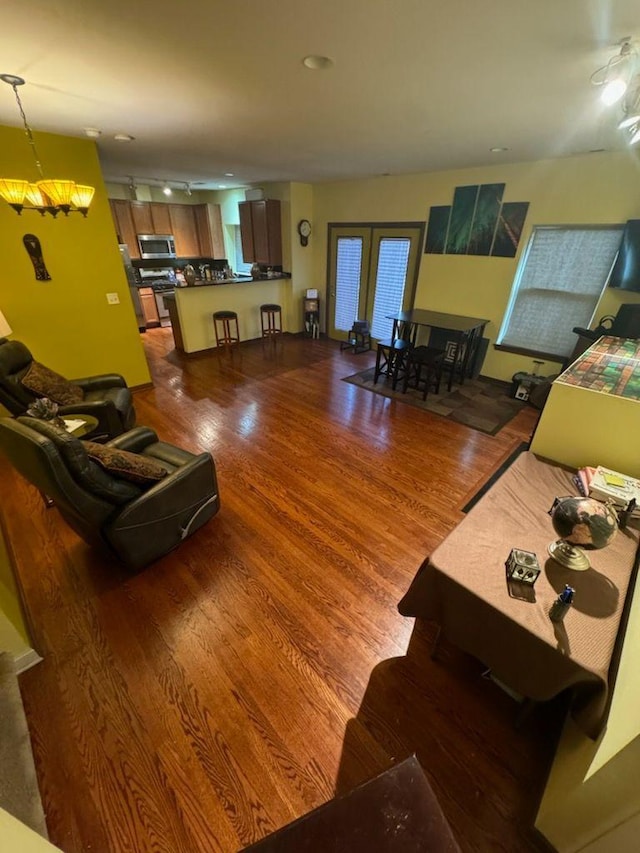 living room with dark hardwood / wood-style floors