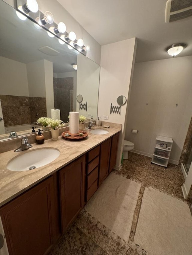 full bathroom with toilet, vanity, and separate shower and tub