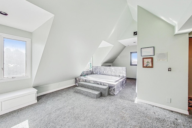 bedroom with carpet flooring and vaulted ceiling