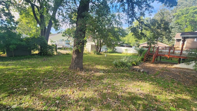 view of yard featuring a wooden deck