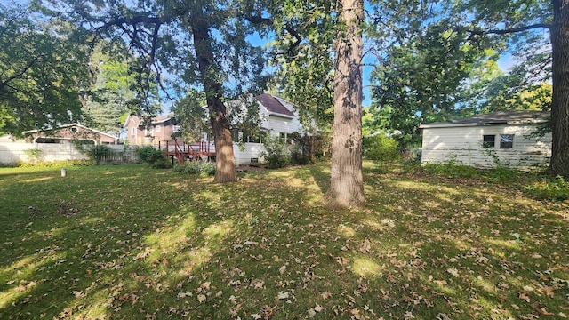 view of yard featuring a wooden deck