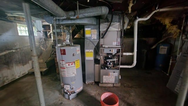 utility room with gas water heater and electric water heater