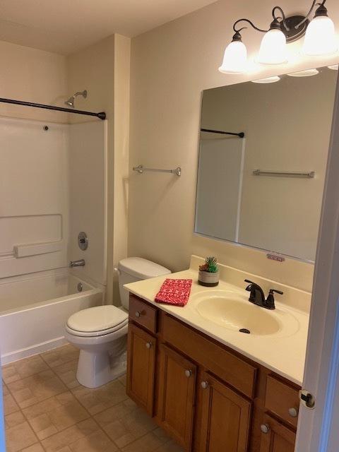 full bathroom featuring vanity, shower / bathing tub combination, and toilet