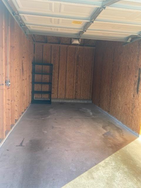 garage with wood walls