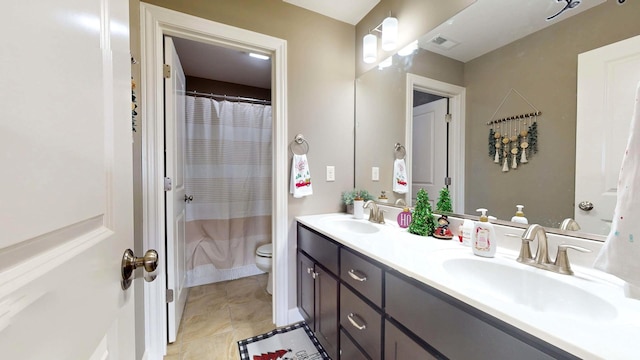 bathroom with walk in shower, vanity, and toilet