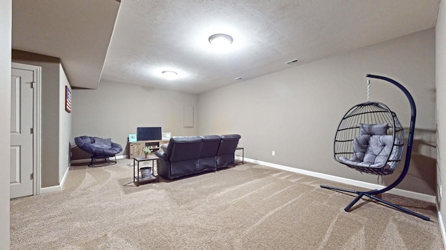 interior space featuring carpet floors and a textured ceiling