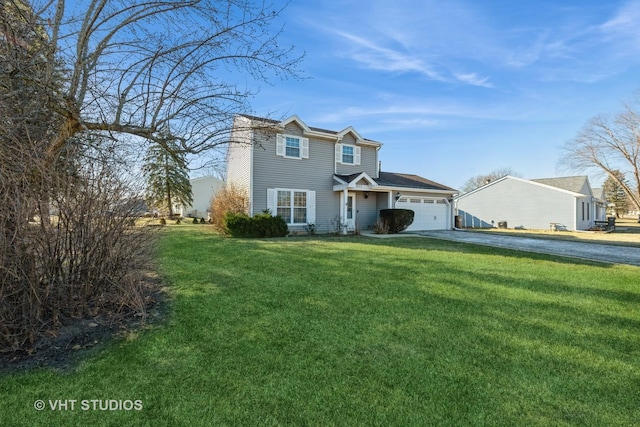 view of front facade with a garage and a front lawn