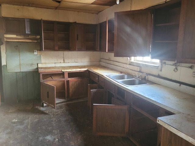 kitchen featuring dark brown cabinetry and sink