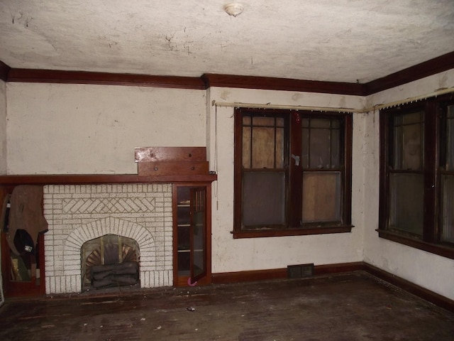 unfurnished living room with a brick fireplace