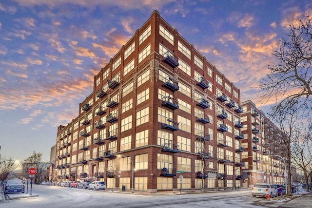 view of outdoor building at dusk