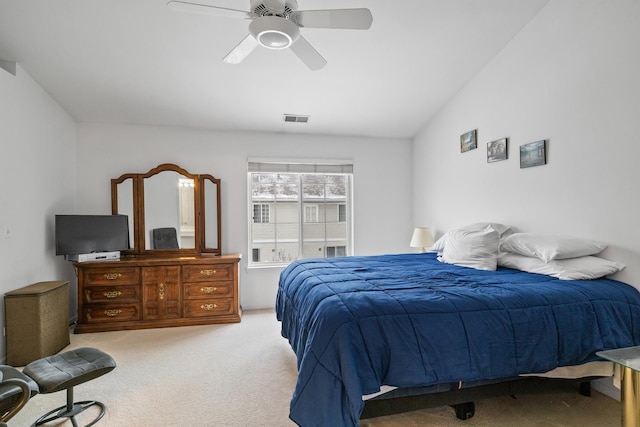 carpeted bedroom featuring ceiling fan and vaulted ceiling