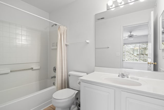 full bathroom featuring shower / bath combination with curtain, vanity, toilet, and ceiling fan