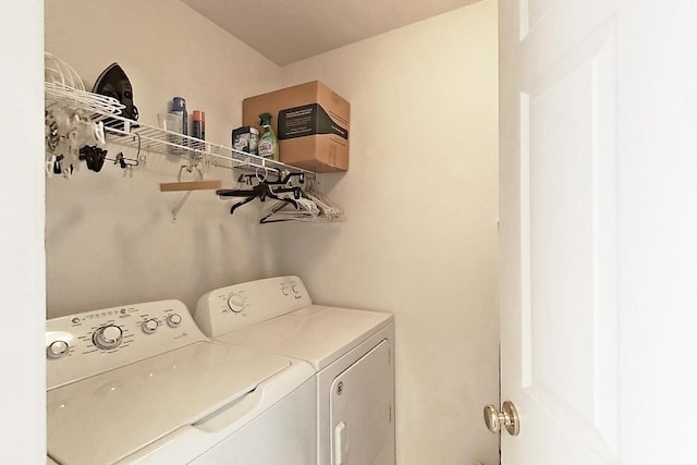 laundry area with separate washer and dryer