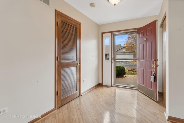 entryway with light wood-type flooring and a wealth of natural light