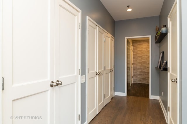 corridor featuring dark hardwood / wood-style floors