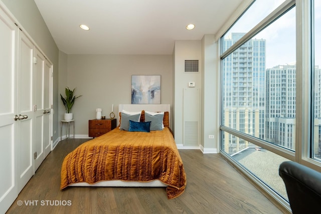 bedroom with hardwood / wood-style flooring