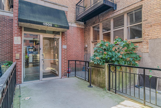 entrance to property with a balcony