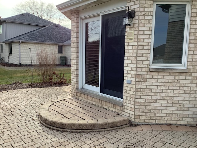 entrance to property with a patio area