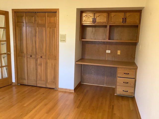 unfurnished office featuring light hardwood / wood-style flooring