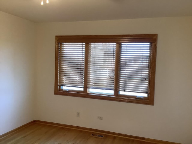 empty room featuring hardwood / wood-style flooring