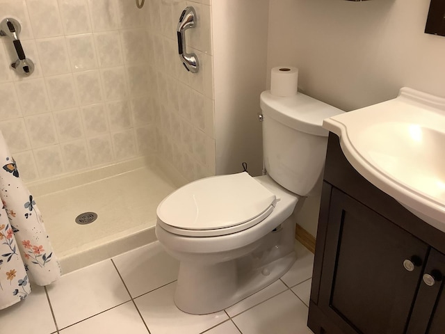 bathroom with curtained shower, tile patterned flooring, vanity, and toilet