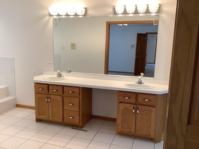 bathroom with tile patterned flooring and vanity