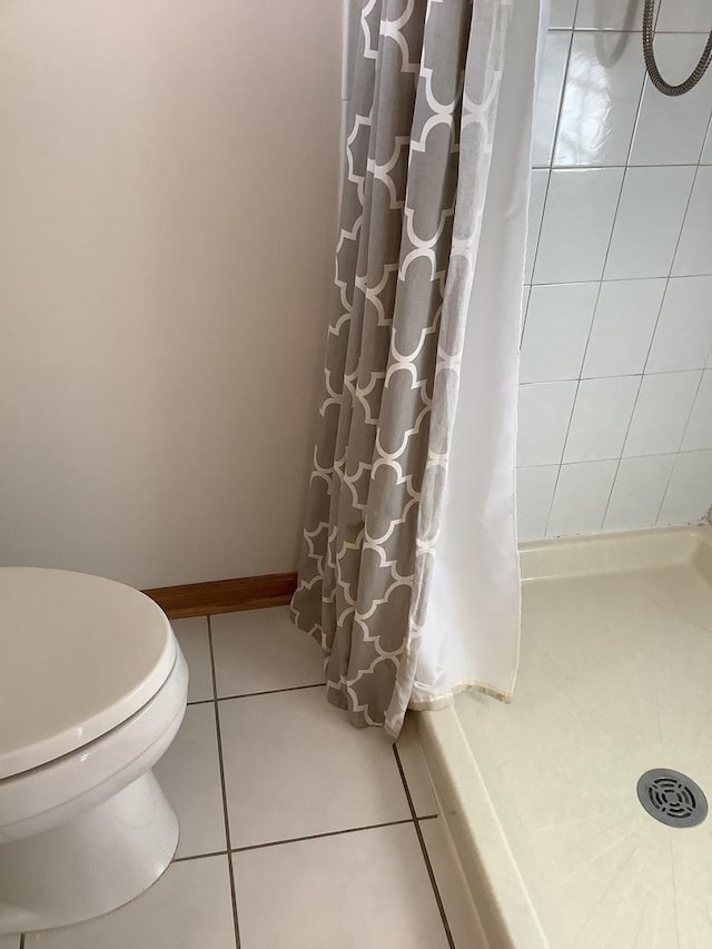 bathroom featuring tile patterned flooring and toilet