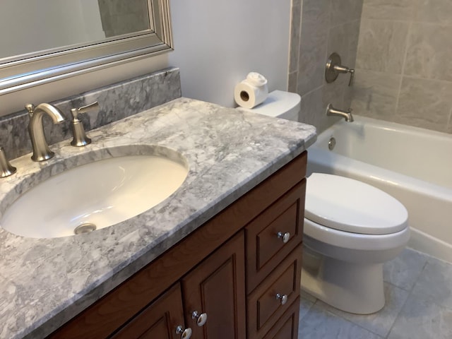 full bathroom featuring vanity, toilet, and tiled shower / bath