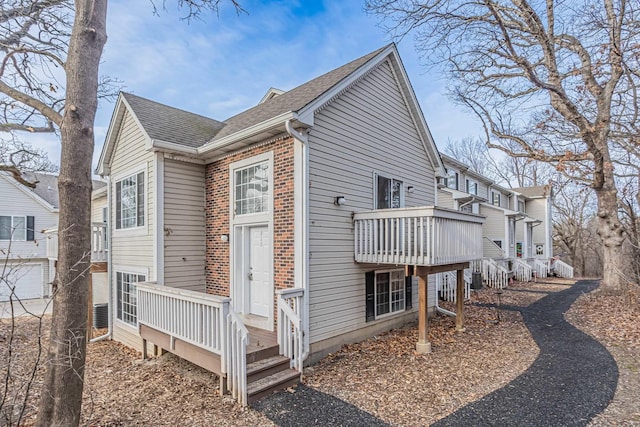 view of home's exterior featuring a wooden deck