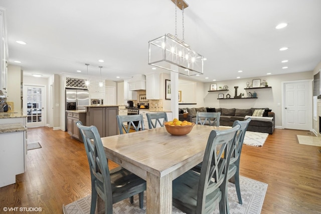 dining area with light hardwood / wood-style floors