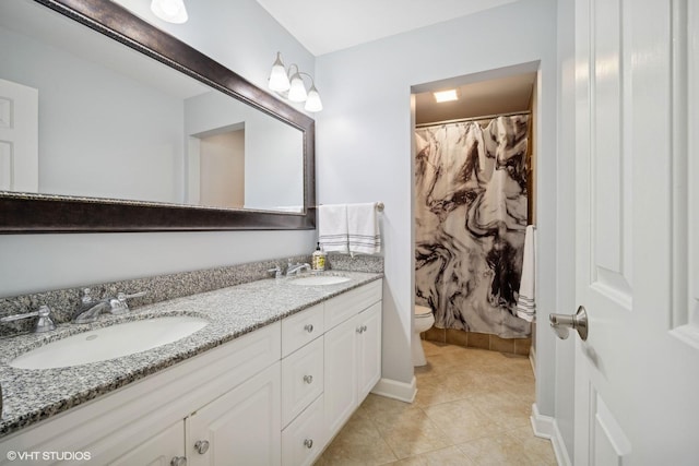 bathroom with toilet, vanity, tile patterned flooring, and a shower with shower curtain