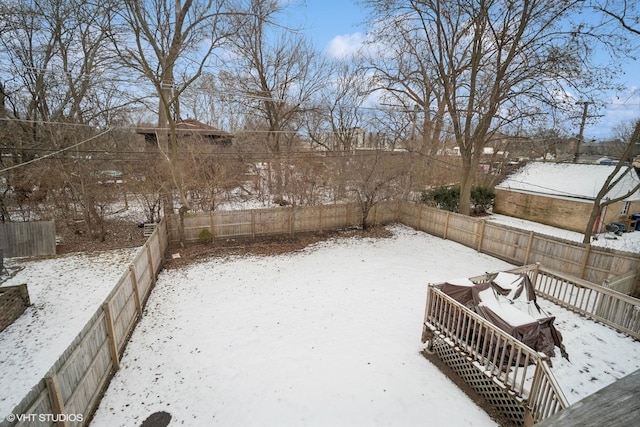 view of yard layered in snow