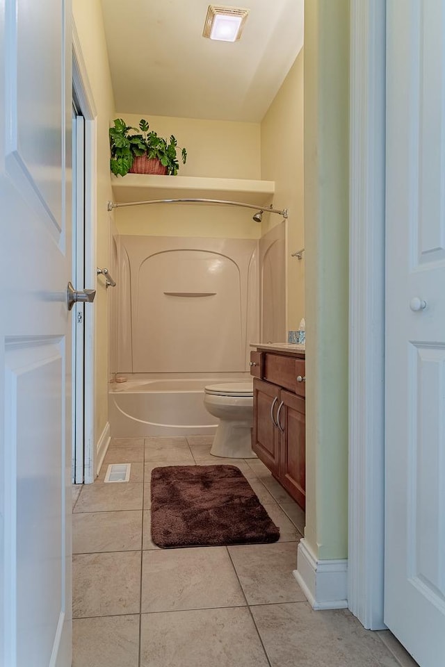 full bathroom with shower / tub combination, tile patterned flooring, vanity, and toilet