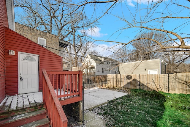 view of yard with a deck and a patio