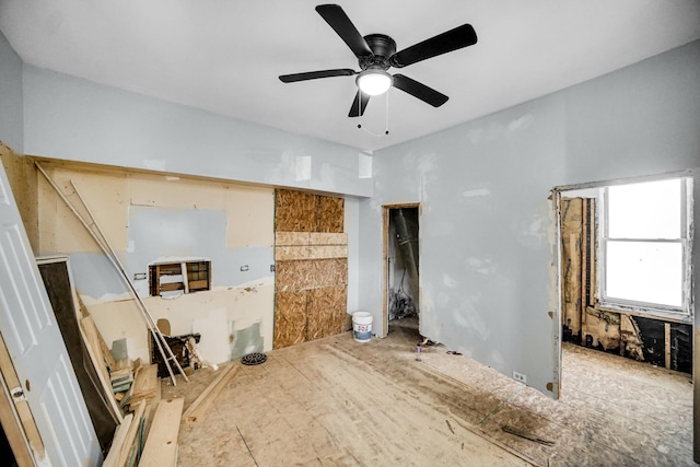 unfurnished living room featuring ceiling fan