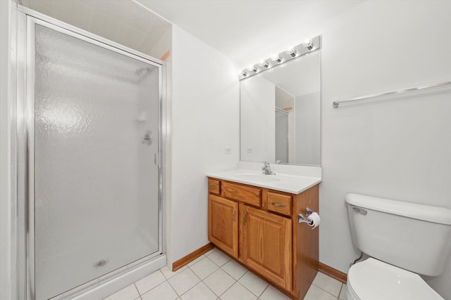 bathroom with tile patterned floors, vanity, toilet, and walk in shower