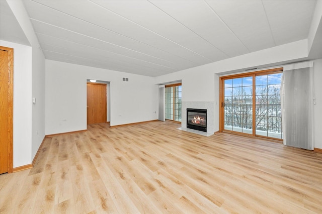 unfurnished living room featuring light hardwood / wood-style floors