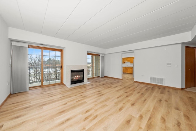 unfurnished living room featuring light hardwood / wood-style flooring