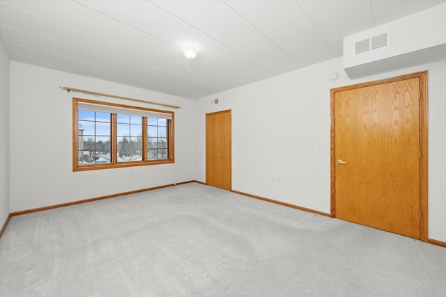 empty room featuring light colored carpet