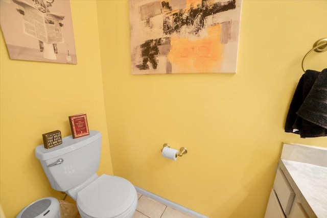 bathroom with vanity, tile patterned floors, and toilet