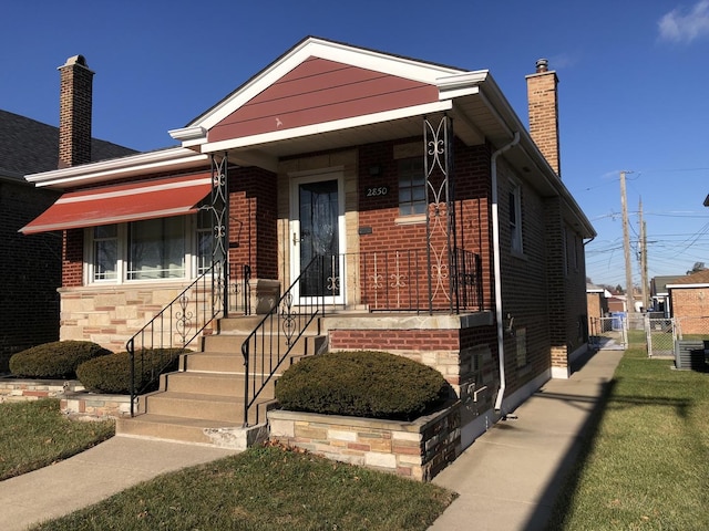 view of front of home featuring cooling unit