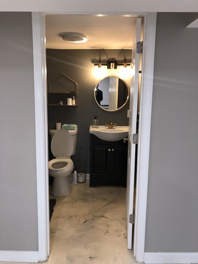 bathroom featuring vanity and toilet