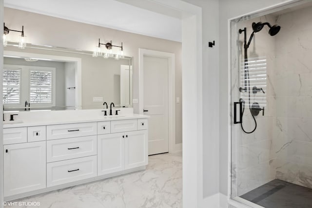 bathroom with vanity and a shower with door