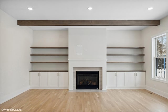 unfurnished living room with light hardwood / wood-style flooring