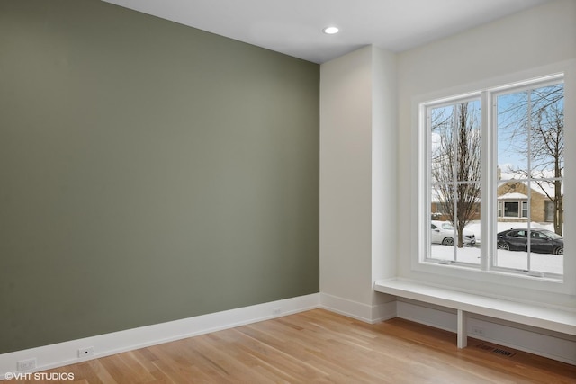 unfurnished room featuring light hardwood / wood-style flooring