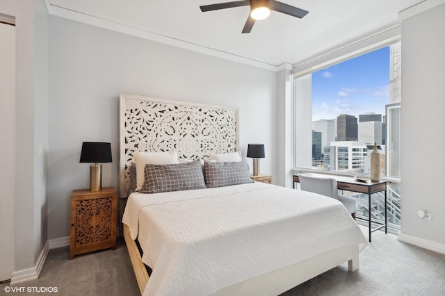 bedroom with carpet floors, ceiling fan, and ornamental molding