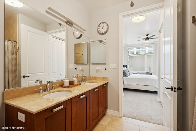 bathroom featuring tile patterned floors, ceiling fan, and vanity