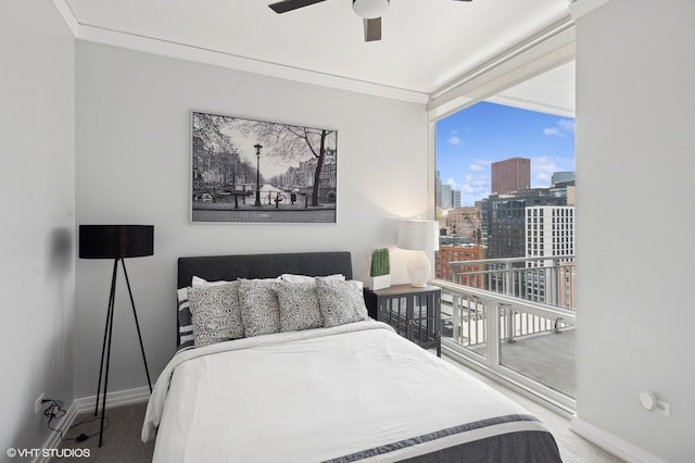 carpeted bedroom featuring ceiling fan, ornamental molding, and multiple windows