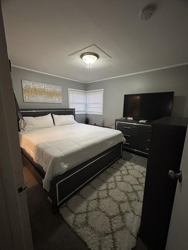 bedroom with crown molding and carpet