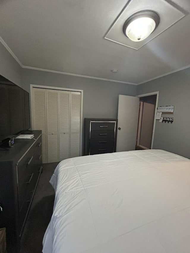 bedroom with ornamental molding and a closet